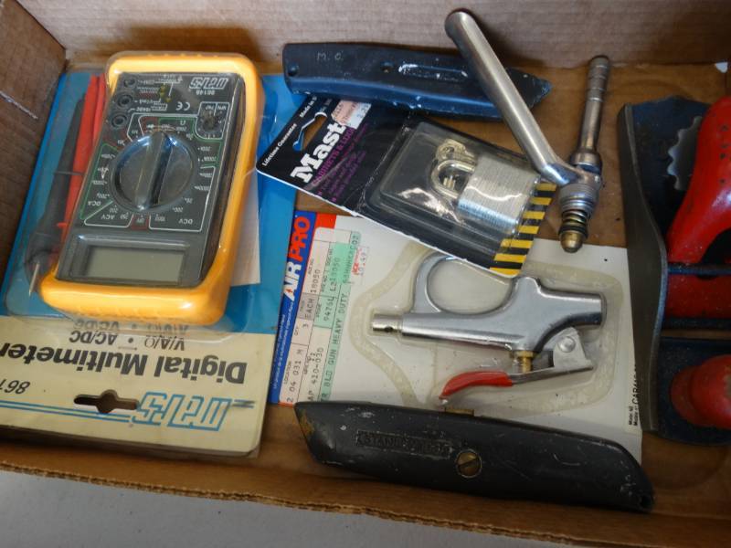 lot 7617 image: Digital multimeter, master lock new, box knifes, air tool heads, & more.