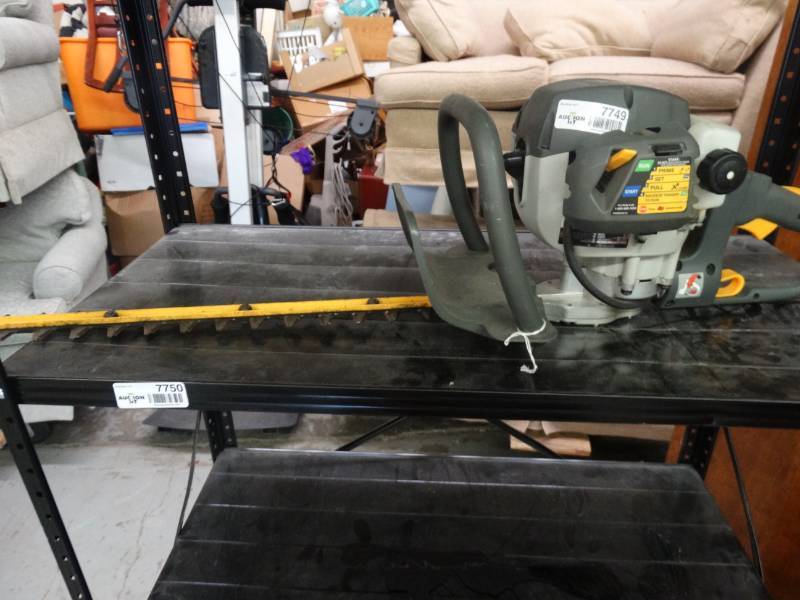 lot 7749 image: Ryobi HT26 gas hedge trimmer.