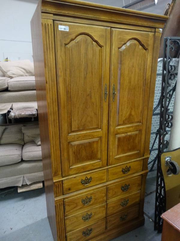 lot 7755 image: Thomasville solid wood armoire.