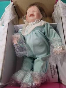 lot 65 image: Ashton Drake My First Tooth Baby Doll by Kathy Barry-Hippensteel