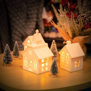lot 3529 image: ZTL 7PCS Christmas Village Sets - 3 LED Lighted Ceramic White Christmas Village Houses with Remote & 4 Trees, Porcelain Miniature Christmas Figurines Decorations for Home Tabletop Mantel Shelf Decor