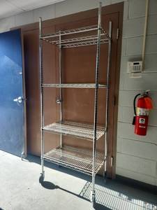 lot 6521 image: 4-Tier Rolling Metal Wire Storage Rack