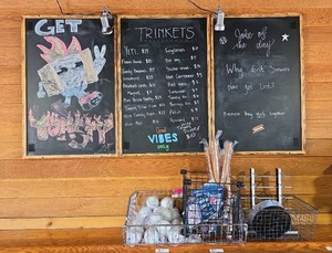 lot 7041 image: Assorted Lot of Baseballs, Storage Containers, Chalk Boards, Magnets, and Small Baseball Bats