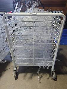 lot 7048 image: Commercial Rolling Garment Cart with Clear Hangers