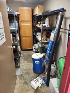 lot 6625 image: Contents of Room Including Industrial Shelving, LED Emergency Lights, and More