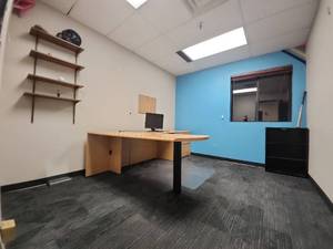 lot 6641 image: Contents of Room Including Office Furniture, Wall Shelving Units, Bookshelf, and More