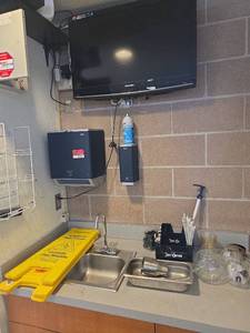 lot 7371 image: Assorted Lot W Sylvania 32 TV, Wet Floor Signs, TowelSoap Dispensers, and More