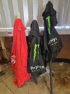 lot 7374 image: Monster Energy and Coca-Cola Outdoor Table Umbrellas - Set of 3