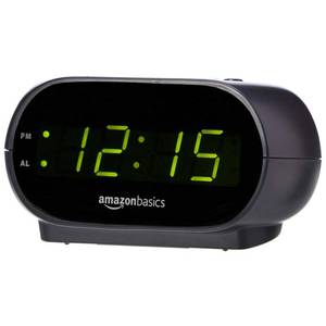 lot 16171 image: Amazon Basics Small Digital Oval Alarm Clock With LED Display, Nightlight & Battery Backup, Black, 4.5 x 3.5 x 2.4 Inches