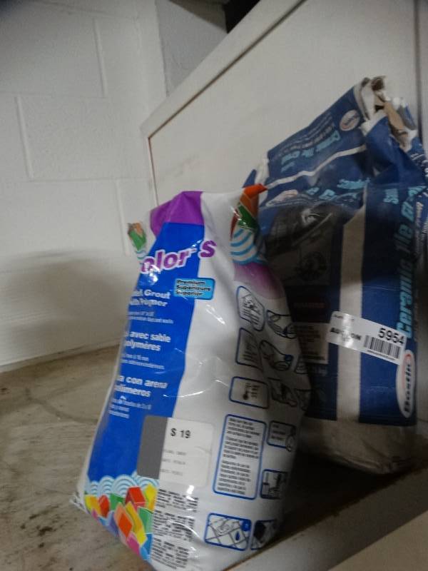lot 5954 image: 2 opened bags of grout
