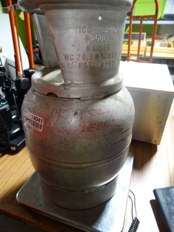 lot 14041 image: Jug of freon- Weighs 14.10 LB