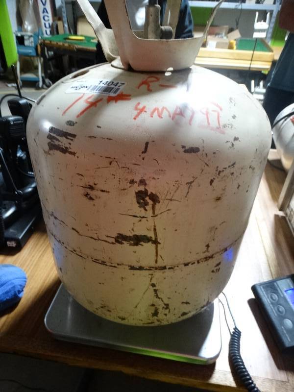 lot 14047 image: Partial jug of R-12 freon- Weighs 14 LB