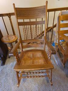 lot 48 image: Oak Pressed Back Rocking Chair with Cane Seat (seat needs repaired)