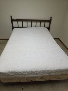 lot 71 image: Queen Size Dark Wood Spindle Headboard and Frame. Has Full Size Boxspring and Mattress if You Want Them.