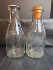lot 202 image: Kalamazoo One Quart Glass Milk Bottle and Clear Glass Milk Bottle with Aluminum Cap