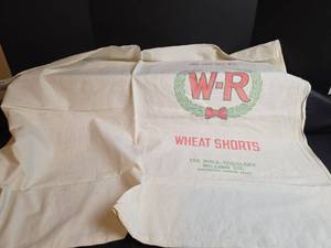 lot 265 image: Wall-Rogalsky Milling Co. Wheat Shorts Feed Sack made into Tablecloth