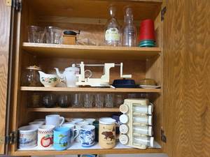 lot 272 image: Kitchen Cabinet Collection with Decorated Teapot, Coffee Mugs, Carafes, Spice Rack, and More