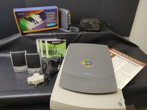lot 1131 image: Microtek ScanMaker X6 Scanner Bundle with Lightlid 35 Slide Adapter, Sony Clock and More