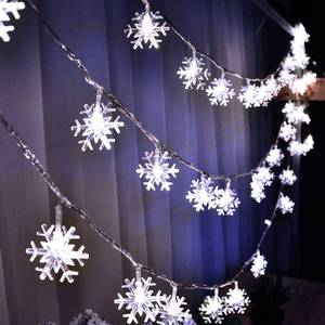 lot 8416 image: WesGen Christmas Lights Snowflake String Lights Battery Operated Waterproof 20ft, 40 LED Fairy Lights for Xmas Garden Patio Bedroom Party Decor Christmas Decorations, White