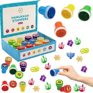 lot 1471 image: The Dreidel Company Box of Twelve Multicolored Hanukkah Stampers, Each Stamp Includes A Fun Chanukkah Icon Including Menorah, Dreidels and Coins, 12-Pack Box