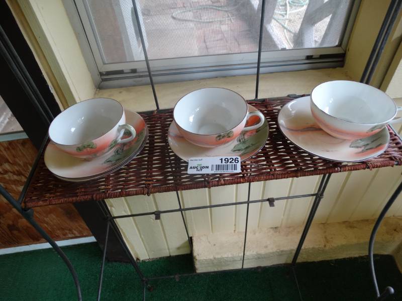 lot 1926 image: 3 Matching tea cups with small plates.