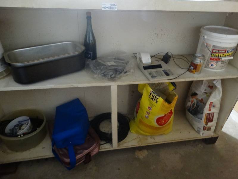 lot 17014 image: Lot of cat liter, electronic calculator, cat food, etc.