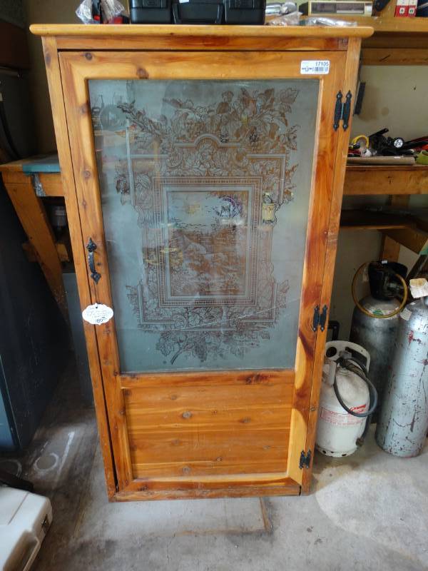 lot 17105 image: Cedar single door gun cabinet w etched glass, broken glass.