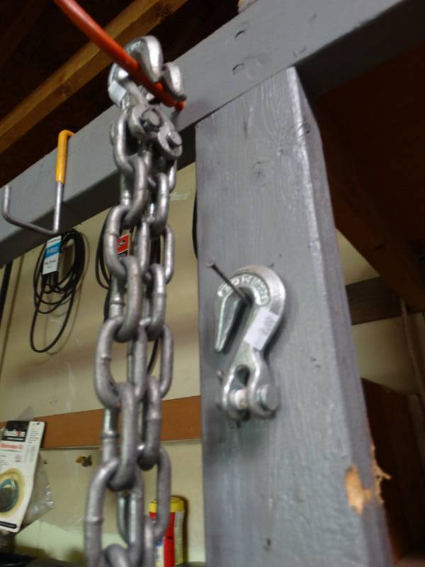 lot 17180 image: Lot of chains, hooks & winch.