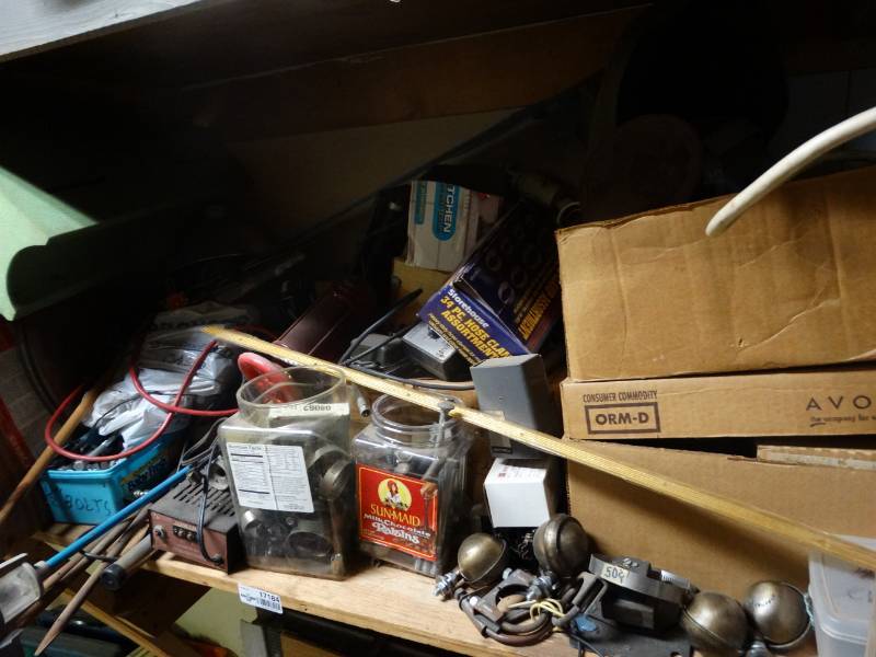 lot 17184 image: Hose clamps, wheels, welding helmet broken, bolts, & more.