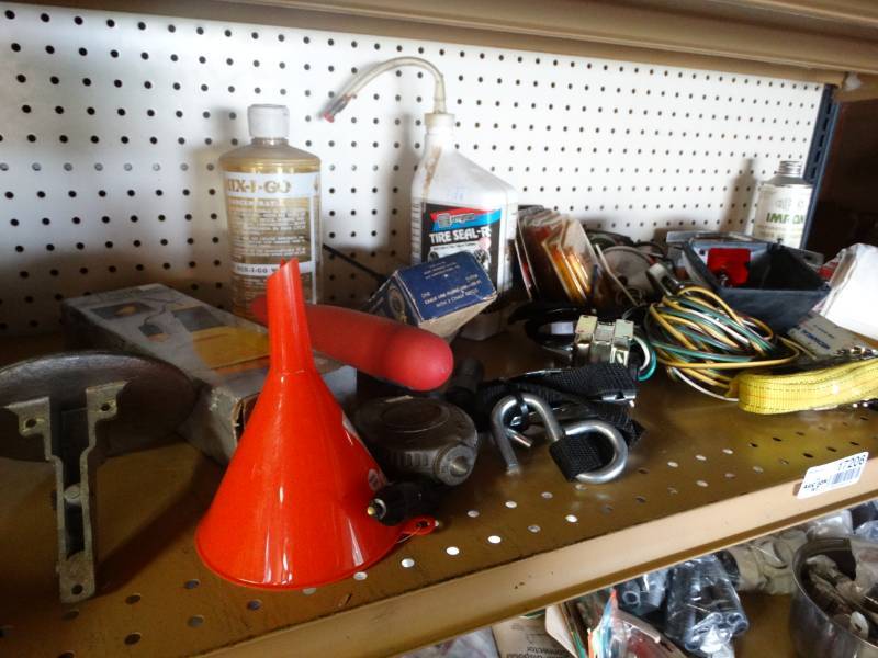 lot 17206 image: Strap, rulers, funnel, tail light covers, & more.
