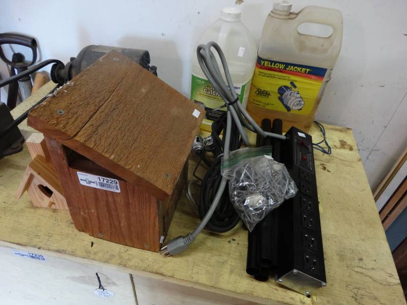 lot 17229 image: 2 Bird houses, power strip, light, bottle jack, & more.