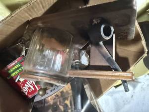 lot 1453 image: Antique lunch pail, thermos, vintage pipes, tobacco cans -- GAR