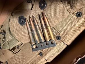 lot 1721 image: U.S. Air Force bailout breathing oxygen bottle, ammo belt with British 303 clips -- SSH