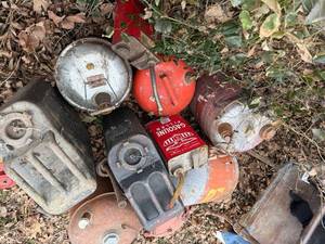 lot 1736 image: Pile of metal gas cans -- BY