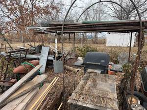 lot 1744 image: Garden trellis, table, BBQ grill, tires, misc. wheels & chains, log chains -- BY