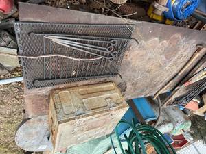 lot 1747 image: Steel table, metal storage box, pick axe, grate -- BY
