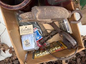 lot 1756 image: Well pulley, crock, can of fuel and misc. -- BY