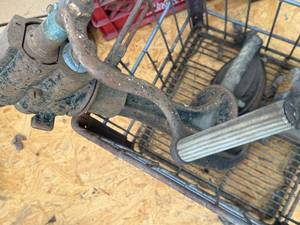 lot 1761 image: Metal milk basket, 2 flat irons - 1 stand, metal forming tool -- BY