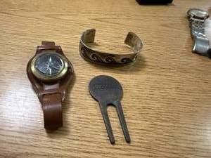 lot 1846 image: TITLEIST SCOTTY CAMERON GOLF DIVOT TOOL, BRACELET & COMPASS
