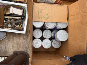 lot 1765 image: 1 box of Mobil engine oil, 2 cans of STP -- BY