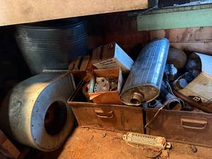 lot 1951 image: Under the bench-Tin stove, Squirrel cage fan, Muffler & More- Shop EW