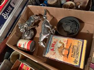 lot 2154 image: MAC BULLDOG HOOD ORNAMENT, MUSTANG HORSE EMBLEM, CAMEL PATCH KIT & MORE- SHOP WW