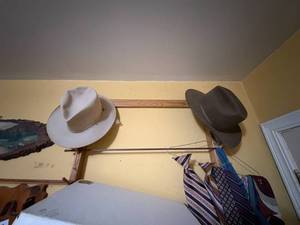 lot 1890 image: GUN RACK (17-GUN RACK), TWO (2) FELT HATS & NECKTIES- SBD