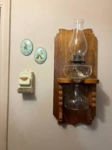 lot 2212 image: VINTAGE OIL LAMP & WOOD WALL HOLDER, TWO (2) METAL MATCHBOX AND SMALL PICTURES- HW