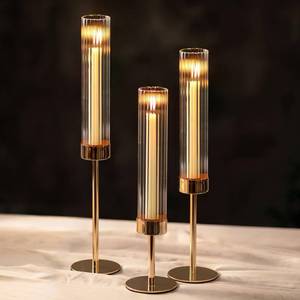 lot 13163 image: NUPTIO Tall Candlestick Holders for Centerpiece Hurricane Candle Stick Holders with Ribbed Glass Sleeve - Gold Metal Candleholder Set of 3 for Table Fireplace Living Room Decor
