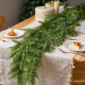 lot 3962 image: JOYIN 6 FT Cedar Christmas Garland, Realistic Pine Designed Thick Lush & Bendable, Green Christmas Garland for Mantle, Table, Porch, Indoor, Xmas Party Decorations