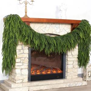 lot 13447 image: Christmas Norfolk Pine Garlands - 6ft Artificial Garland Faux Green Fake Pine Needles Garland for Fireplace,Table,Window,Stairs,Mante,Holiday Indoor Outdoor Xmas Decor(2PCS)