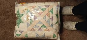 lot 23913 image: Vintage Handmade Star Quilt with a Diamond Border, likely in pastel floral patterns