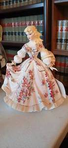 lot 23916 image: Vintage Lefton porcelain figurine of a woman in a large dress with red flowers