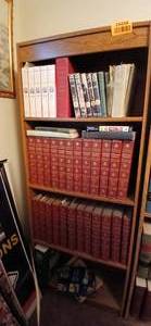 lot 24258 image: Wooden Bookshelf with Books Consisting of The Summa Theologica of St. Thomas Aquinas Volume 1-5, Encyclopedias, and More